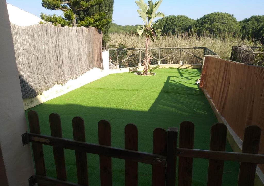Islantilla Apartment | Adosado con jardín en urbanización con piscina