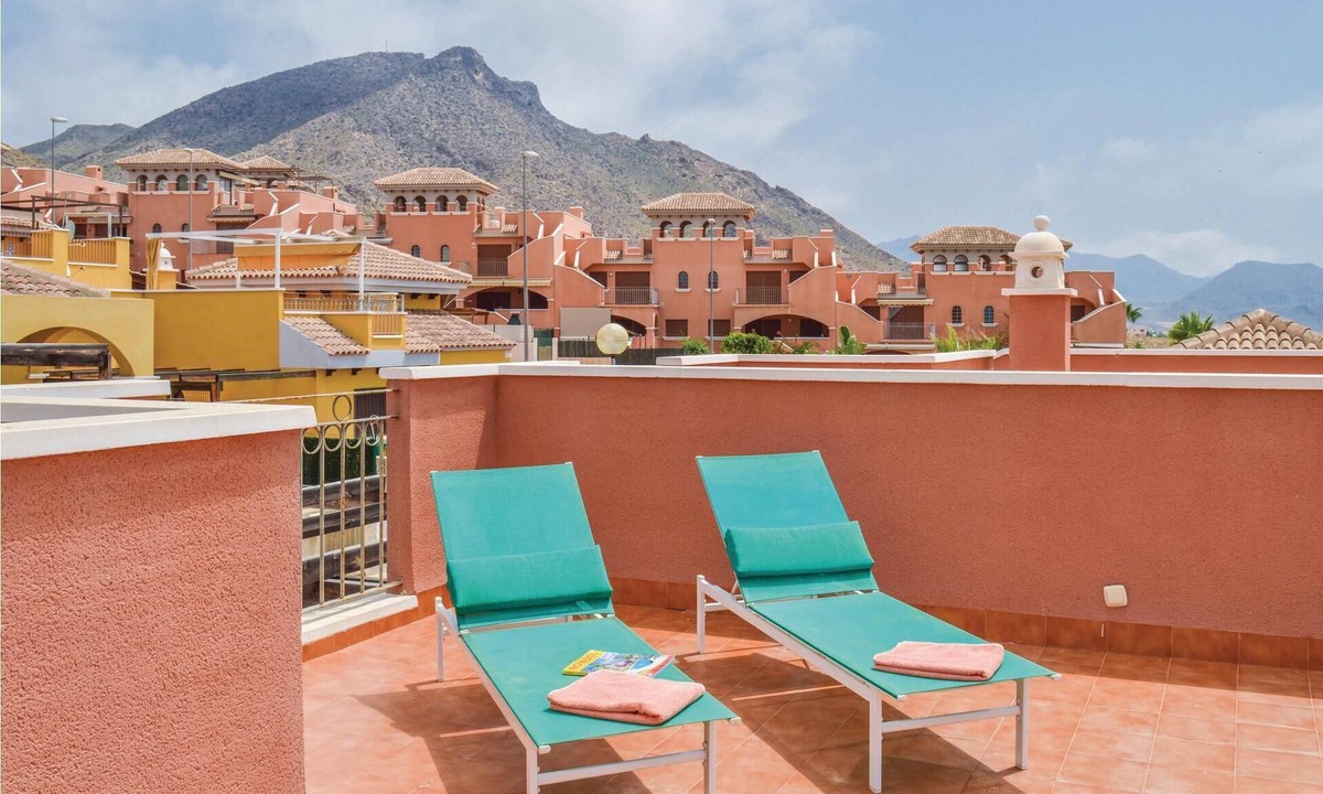 Los Puertos House | This cozy vacation terraced house with terrace is located only 650 meters from the pebble beach and