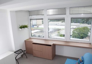 Blue apartment with double bedroom and living room / kitchen with sofa bed and private bathroom