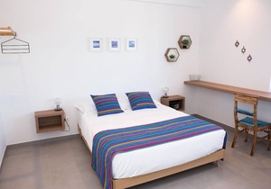 Blue apartment with double bedroom and living room / kitchen with sofa bed and private bathroom