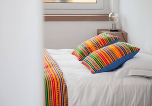 Yellow apartment with double bedroom and living room / kitchen with sofa bed and private bathroom