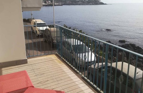 Aci Castello Apartment | Charming sea-front Bivani Aci Trezza two meters from the sea, on the cliff.