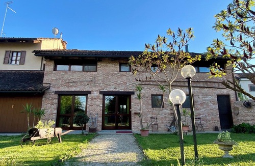 Cornale House | Beautifully restored farmhouse with pool immersed in the greenery