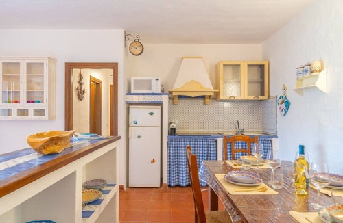 Capo Coda Cavallo Apartment | Blue Dawn: Panoramic Apartment Just Steps from the Sea