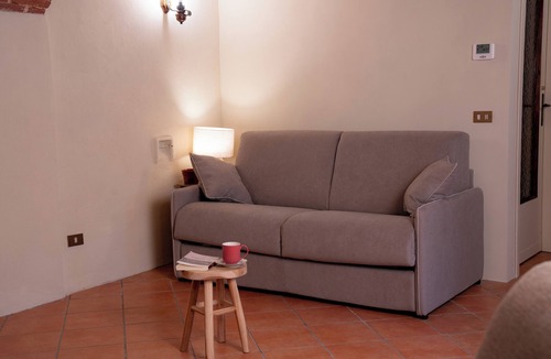 Lessona Bed & Breakfast | Bruno Selvago's Casba. Rustic house with exposed brick surrounded by vineyards.