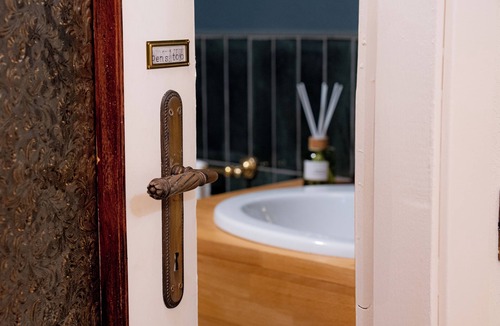 Lessona Bed & Breakfast | Bruno Selvago's Casba. Rustic house with exposed brick surrounded by vineyards.