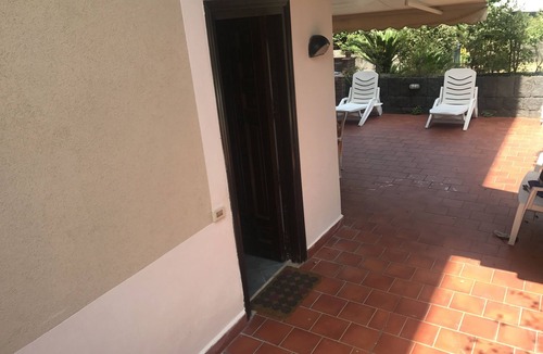 Acireale Apartment | Capomulini villa with private garden, descent to the sea and seasonal swimming pool.