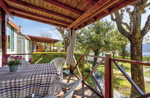 Pratolungo RV Rental | Caravan 'Mobile Home Comfort Standard' with Lake View, Shared Pool and Wi-Fi