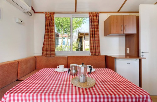 Pratolungo RV Rental | Caravan 'Mobile Home Comfort Vista Lago' with Lake View, Shared Pool and Private Garden