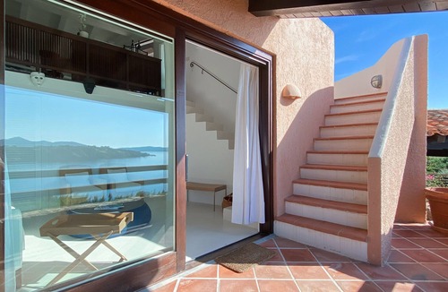Porto Rotondo Apartment | Designer apartment overlooking the bay. Shared pool, access to the sea