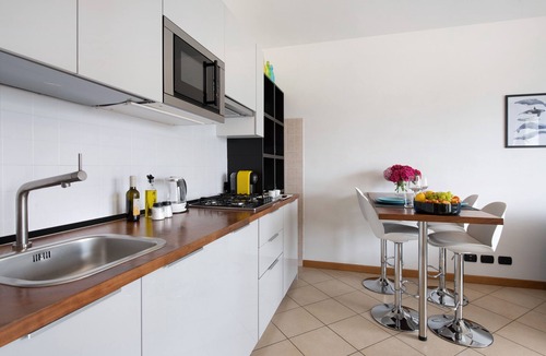 Predore Apartment | Holiday Apartment "Residence Perlago Fiordaliso" with Lake View, Shared Terrace & Wi-Fi