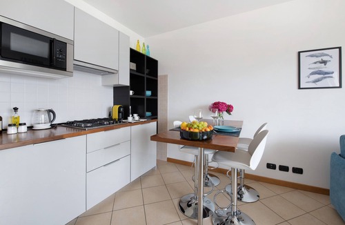 Predore Apartment | Holiday Apartment "Residence Perlago Fiordaliso" with Lake View, Shared Terrace & Wi-Fi