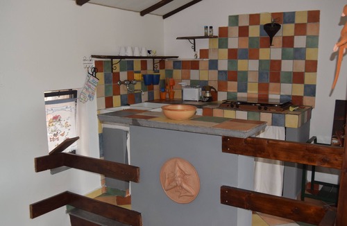 Santa Venerina Cottage | House surrounded by greenery surrounded by olive trees lemons oranges and chestnut trees