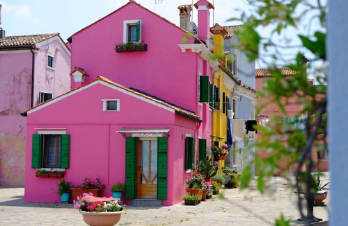 Burano House | Pink artist's house on the edge of the lagoon, overlooking Torcello and the Alps.