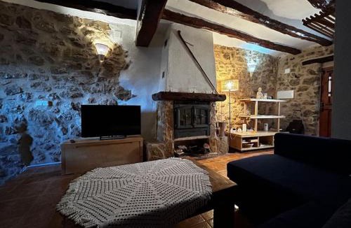El Pinell de Brai House | Rural Stone House with wood fireplace