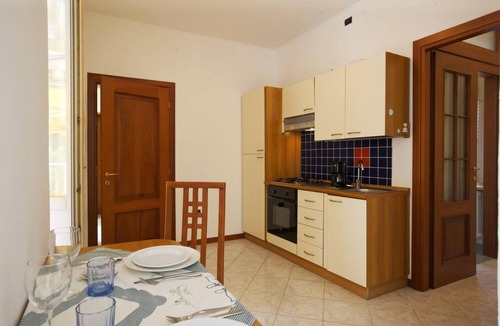 Susello Apartment | Spacious 1½-room apartment with balcony and pool and generous park