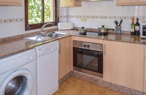 Los Puertos House | This cozy vacation terraced house with terrace is located only 650 meters from the pebble beach and