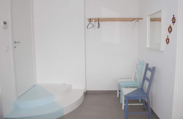 Blue apartment with double bedroom and living room / kitchen with sofa bed and private bathroom
