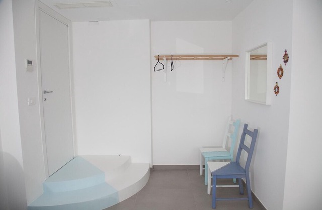 Blue apartment with double bedroom and living room / kitchen with sofa bed and private bathroom