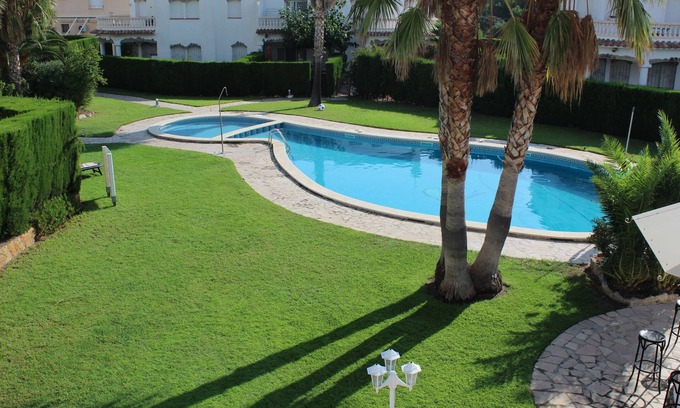 Miami Platja House | Family-friendly bungalow complex with a lot of green and a large pool